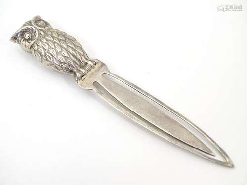 A .925 silver bookmark surmounted by an owl. 3 ½” long overall.