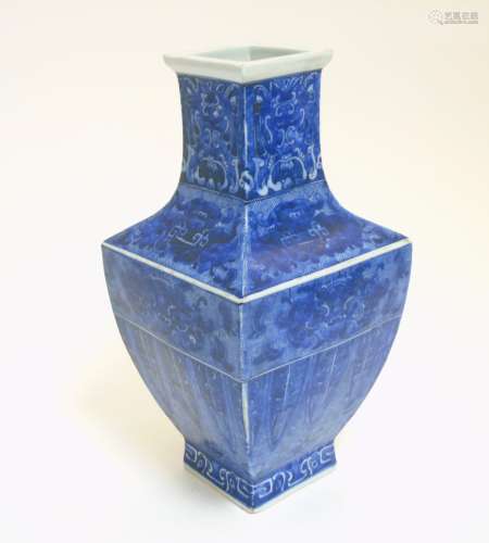 A Chinese blue and white square section vase, with archaic style decoration ,
