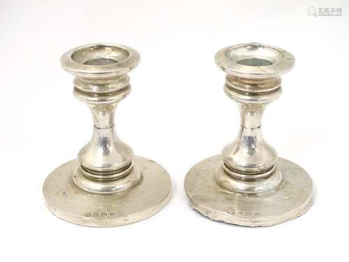 A pair of short sliver candlesticks hallmarked Birmingham 1921 maker James Deakin & Sons.