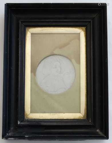 A black framed plaque Lithophane formed as a circular medallion depicting a child with a bird 3