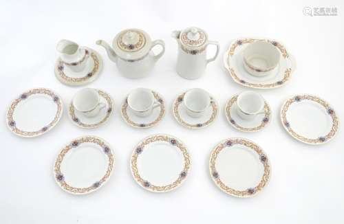 A Czecho Slovakie tea set with banded decoration to include still lifes in vignettes.