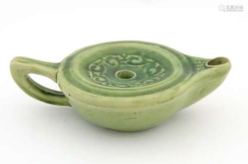 A Liberty London green glazed Arts and Crafts pottery oil lamp,
