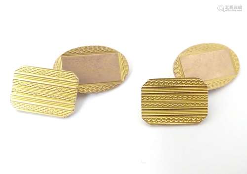 Cufflinks with engine turned decoration. Marked 9ct gold. (5.