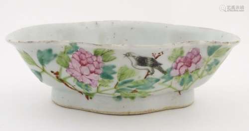 An oriental quatrefoil/lozenge shaped dish with hand painted decoration to include Chinese