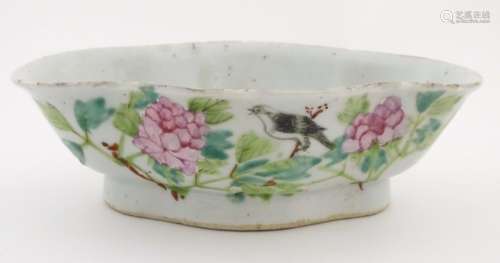 An oriental quatrefoil/lozenge shaped dish with hand painted decoration to include Chinese