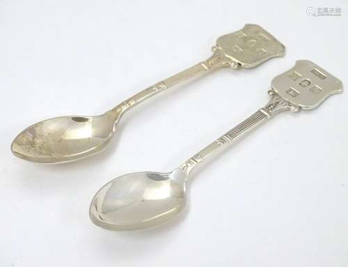 A pair of silver teaspoons hallmarked Birmingham 1977 with Silver Jubilee mark.