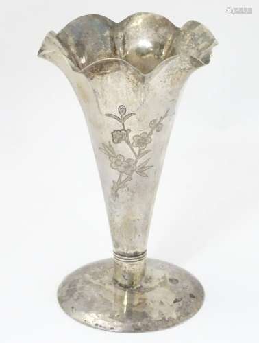 Chinese Export silver : A silver vase with flared rim and engraved decoration.