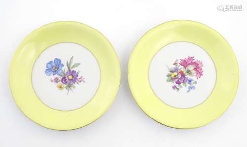 Two KPM hand painted floral plates. Approx.