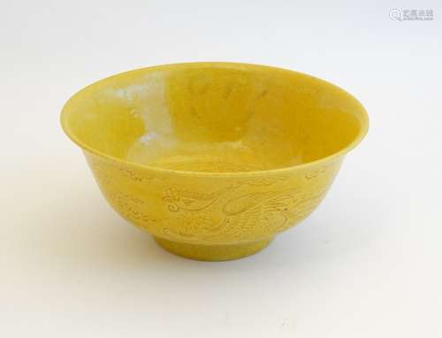 A Chinese Imperial yellow glazed, incised dragon bowl , decorated with 5 clawed dragon and phoenix ,