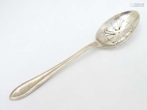 A silver straining spoon with pierced bowl hallmarked Sheffield 1988 maker Roberts & Belks 8 1/4