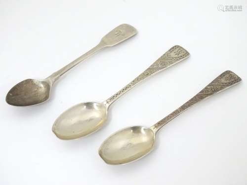 A pair of silver teaspoons with bright cut decoration.