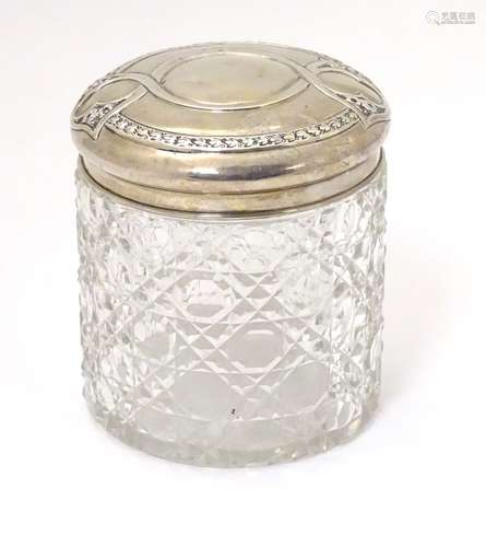 A cut glass dressing table pot with white metal top 3 1/2