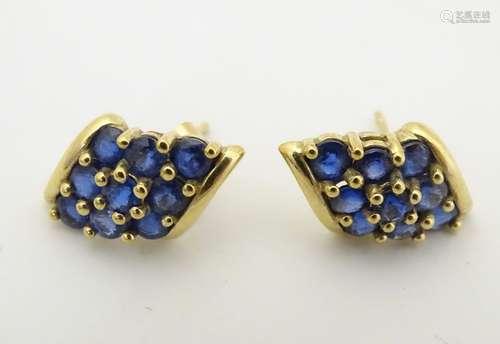 A pair of Vintage 9ct gold stud earrings set with blue spinel..