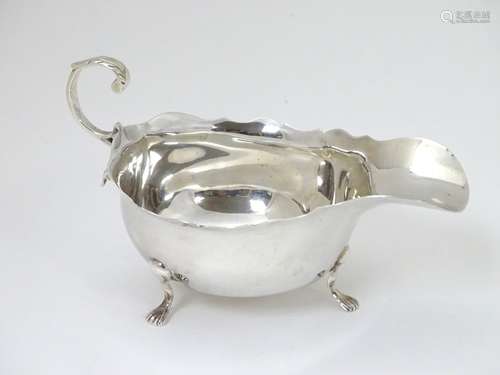 A silver sauce boat hallmarked London 1904 and stamped ' Mappin Brothers 220 Regent St. W.