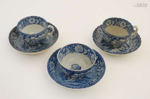 A set of three early 19thC pearlware transfer printed blue and white teacups / teabowl and saucers
