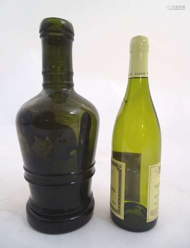 A large olive green bottle , circa 1820 ,