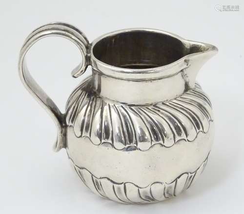 A silver cream jug hallmarked London 1770 (82g) CONDITION: Please Note - we do not