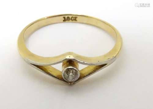 A Vintage 18ct gold ring set with diamond solitaire within an openwork setting