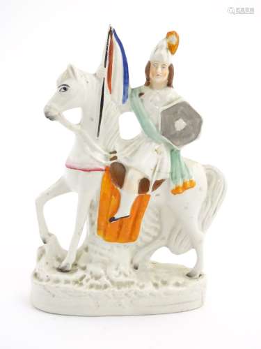 A Staffordshire pottery flat back knight on horseback. Approx. 11” high.