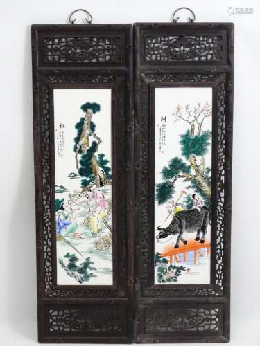 A pair of Chinese hardwood screens each with openwork decoration and an inlaid Chinese ceramic