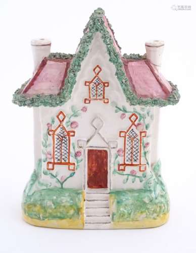 A Staffordshire pottery flat back house. Approx. 8 ½” high x 6” wide.