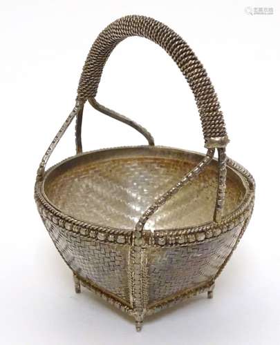 A small white metal basket with basket weave and gilt decoration. Possibly Indian. Approx 3