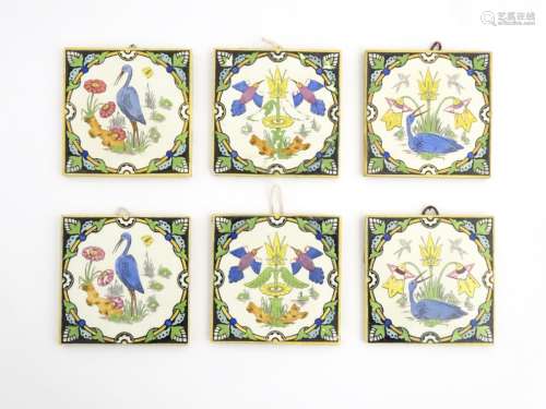 Three pairs of Minton, Hollings & Co. patent tiles, decorated with hand painted birds and flowers.