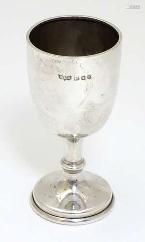 A small silver trophy cup hallmarked London 1957 maker Roberts & Dore Ltd.