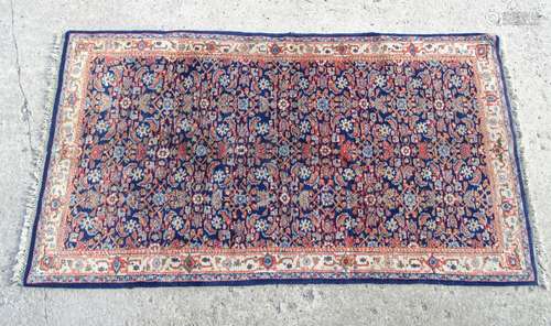 Rug / carpet :an unusual hand made Ukrainian made rug with blue edging and central ground ,