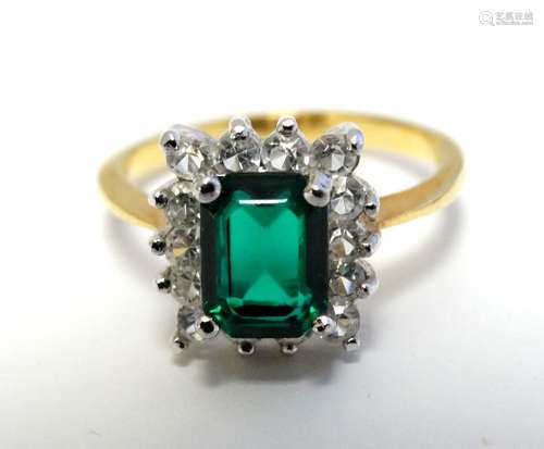 A gilt metal dress ring set with green and white stones CONDITION: Please Note -