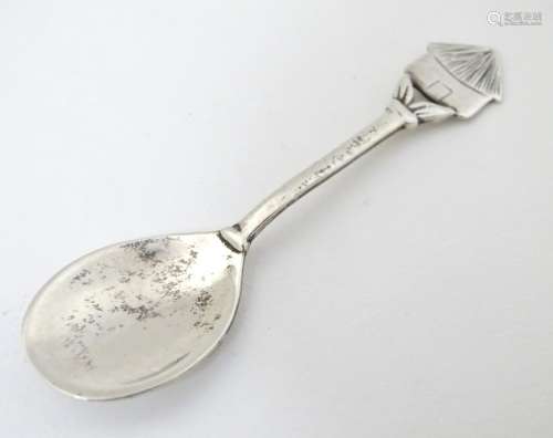 Lesotho souvenir : A silver salt spoon, the handle surmounted by image of a Lesotho hut / rondavel.