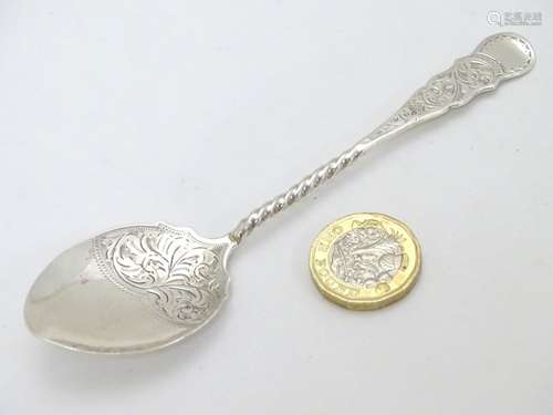 A silver preserve spoon with engraved decoration hallmarked Birmingham 1906 maker William