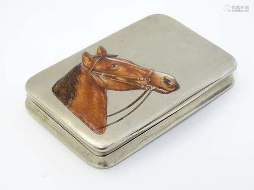 A white metal box with enamel horse head decoration to top.