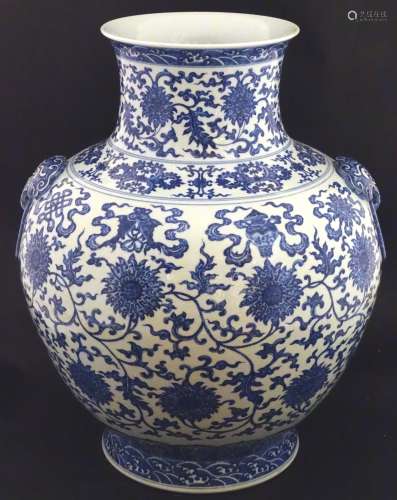 A large Chinese blue and white vase, depicting scrolling lotus with shou character to centre flower,