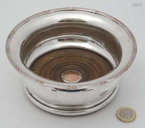 A late 19thC / early 20thC silver plate coaster with turned wooden base 6