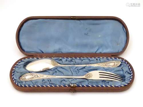 A cased silver plate Christening set comprising knife and fork.