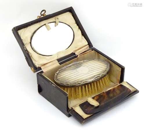 A travelling set comprising comb, brush and mirror,