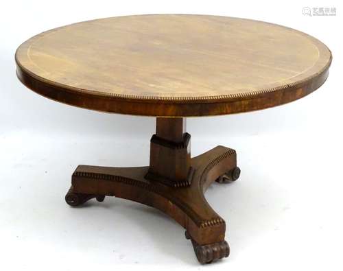 An impressive Regency pedestal tilt-top breakfast table of circular form,