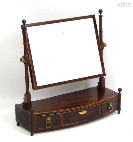 A 19thC mahogany toilet mirror with boxwood stringing throughout,