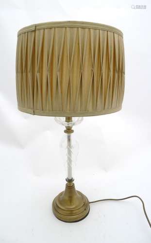 A lacquer brushed bronze effect and glass table lamp with pleated silk shade glass and brass lamp