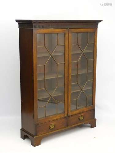 A 19thC Astral glazed mahogany cabinet with dentil cornice ,