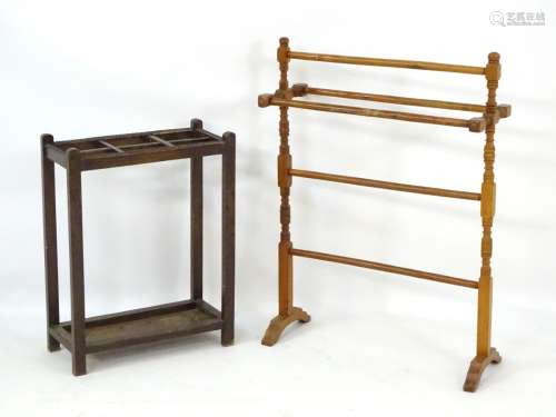 An early 20thC walnut cruciform towel rail together with an early 20thC oak six sectional stick