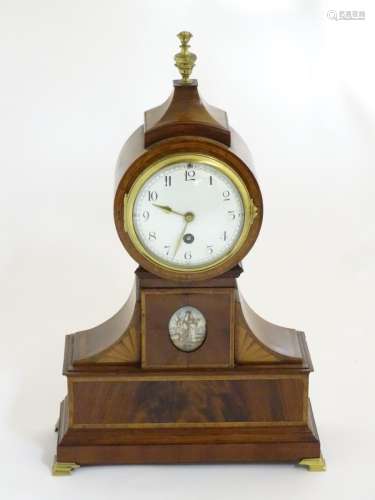 An Edwardian balloon clock : a cross banded and inlaid mahogany Key Hole shaped ballon Timepiece
