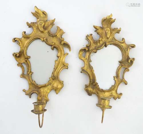 A pair of Rococo style late 20thC gilt girandoles with single sconces.