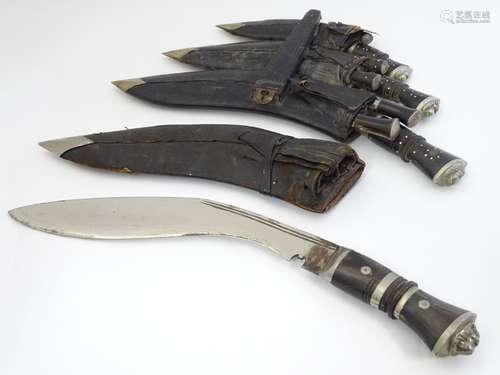 Militaria: An assortment of Gurkha Kukri knives, in single and triple scabbards,