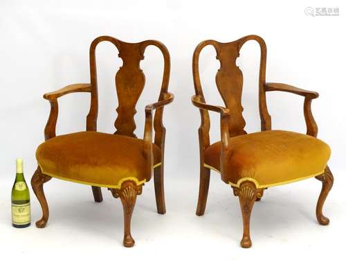 A pair of early 20thC walnut Queen Anne style low chairs with vase shaped back splat and standing