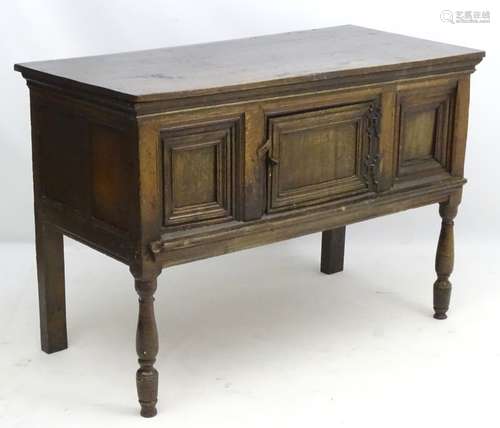 A late 17thC oak counting table / serving table with panelled front and sides,