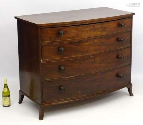 A mid 19thC mahogany chest of drawers comprising four oak lined graduated drawers,