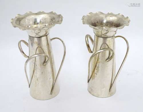 Arts and Crafts : a pair of silver plated flared wavy rim vases each with three loop handles ,