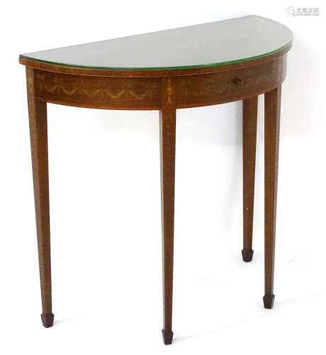 A late 19thC / early 20thC mahogany ‘Edwards & Roberts’ demi lune table with marquetry decoration